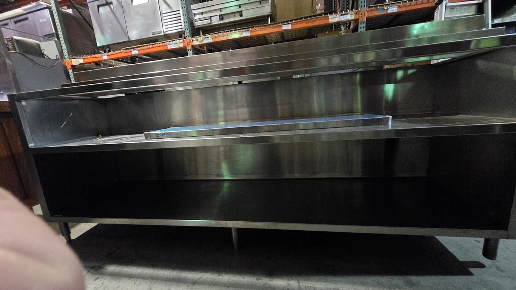 Commercial-grade Stainless Steel Service Counter With An Detached Upper Shelving Unit.