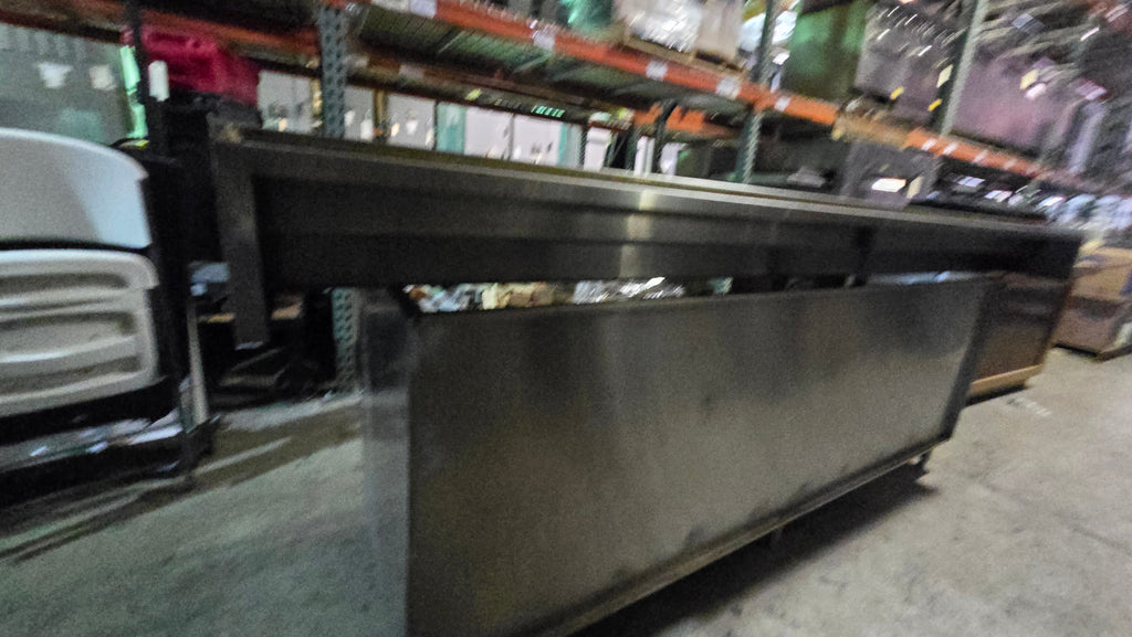 Commercial-grade Stainless Steel Service Counter With An Detached Upper Shelving Unit.