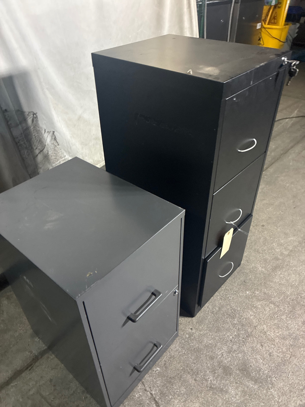 Assorted File Cabinets, 1: 2 Drawer 24”, 1: 3 Drawer 47.25” - Lot Of 2