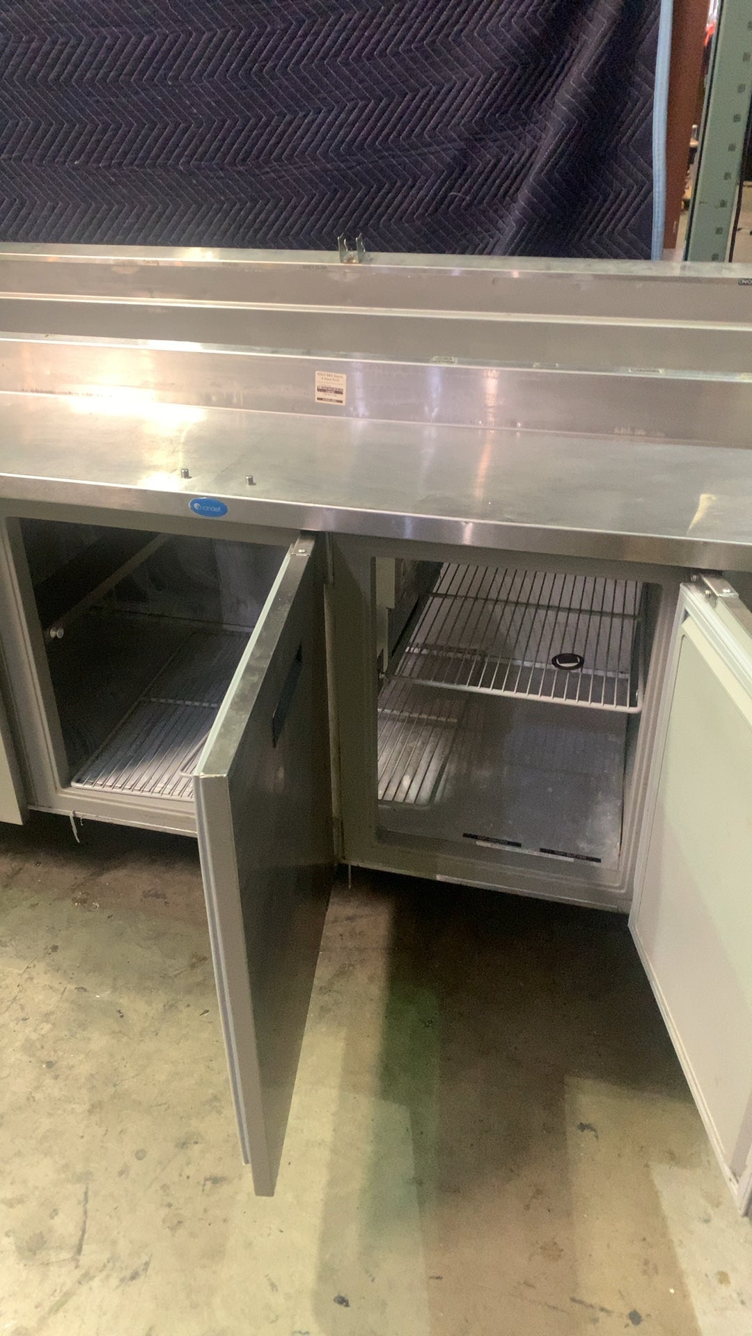 Randell 8383N-290 Salad/Sandwich Prep Table, Raised Rail, Four Door Stainless Steel, On Casters, Adjustable Shelves