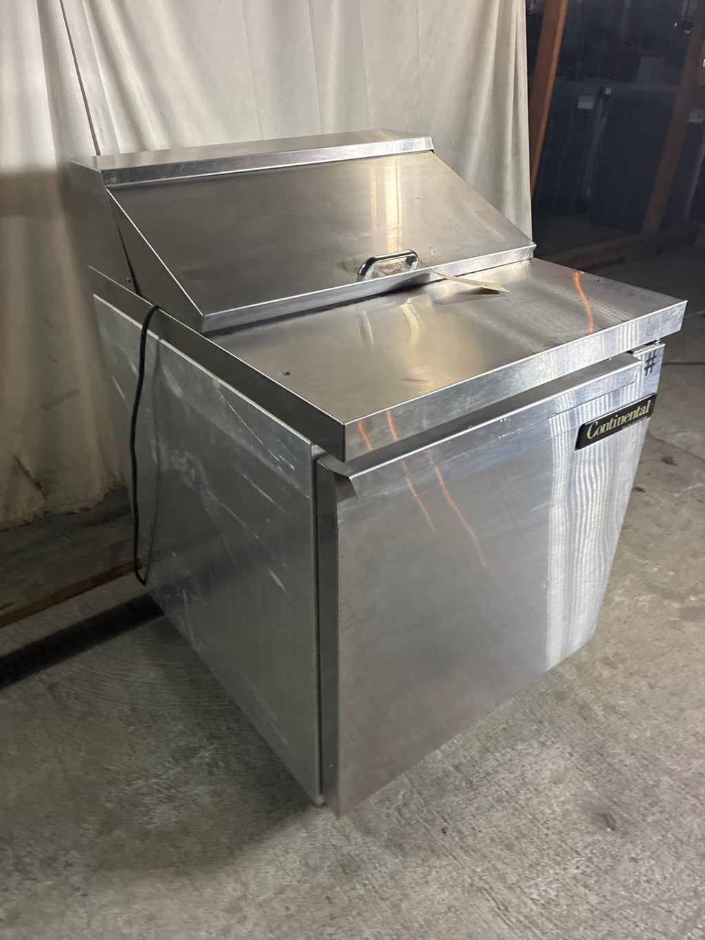 Continental SW27-8 Sandwich Prep Table, Single Solid Swing Door, Stainless, Mobile
