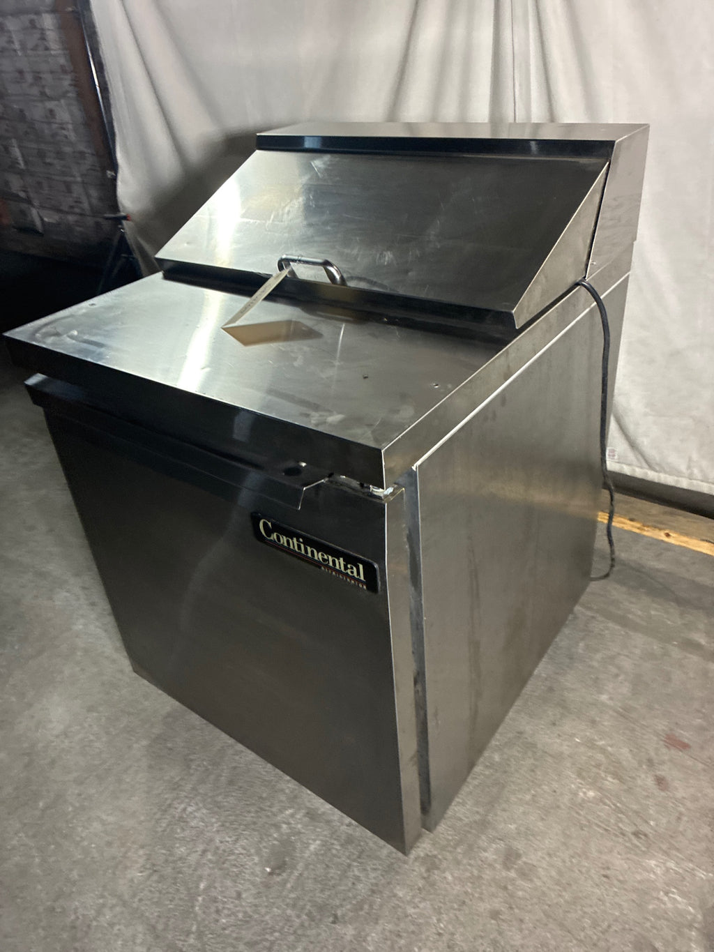 Continental SW27-8 Sandwich Prep Table, Single Solid Swing Door, Stainless, Mobile