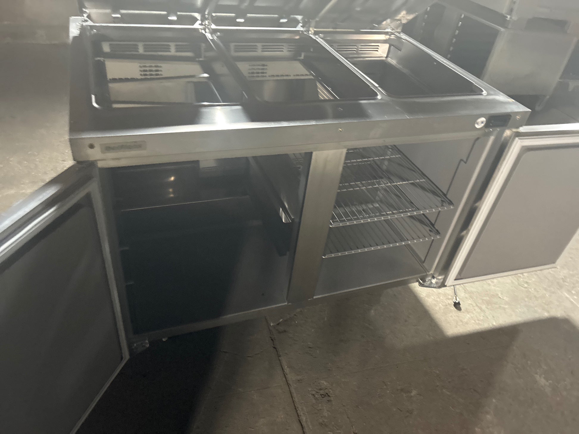 Delfield 4448NP-18M-A1454 Sandwich Prep Table, 3 Wells, 2 Solid Swing Doors, Stainless, Mobile